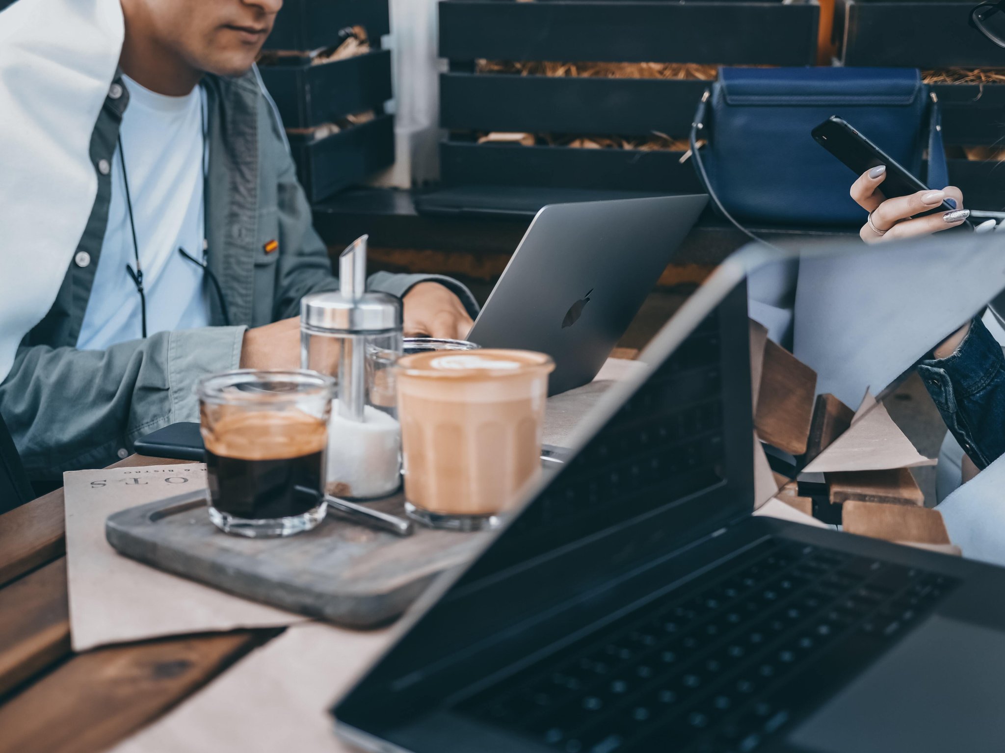 Laptops on a table with coffee